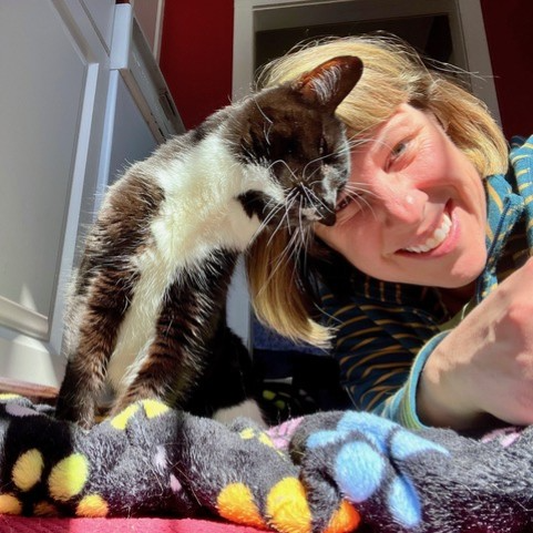 Sandy with one of her cats.